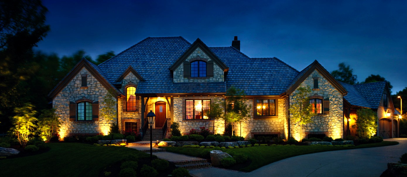 Photo from outside looking at house exterior lighting
